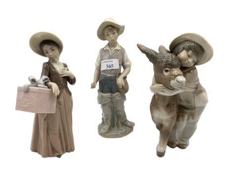 Three Lladro figures. 
