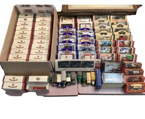 A collection of boxed and unboxed die cast model cars, mostly with advertising livery. Oxford Die Cast, Lledo etc. 