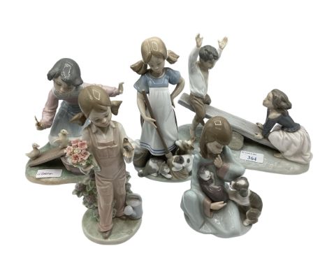 A collection of five LLadro figures. 