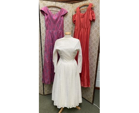 A group of long dresses circa 1950s/1960s, comprising Peter Robinson London pink/blue brocade dress with stiffened underskirt