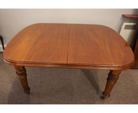 Mahogany Extending Dining Table, circa late 19th / early 20th century, Having two Additional Leaves, Raised on Baluster Legs 