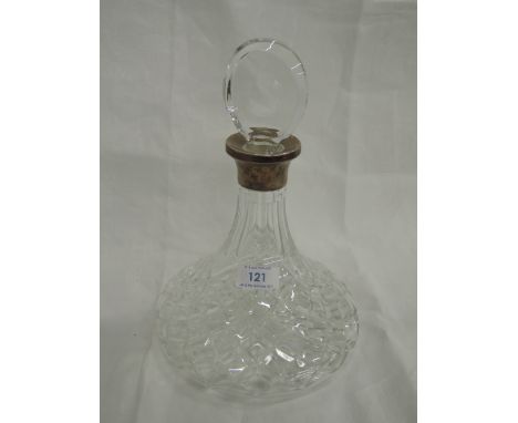 A cut glass ships decanter having an HM silver collar, London marks possibly 1983
