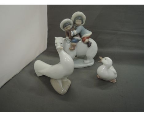 A Lladro study, Polar Bear with two Eskimo children and two Nao studies, Dove and Duckling