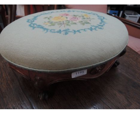 A Victorian stained frame footstool having later floral tapestry top and knurl feet