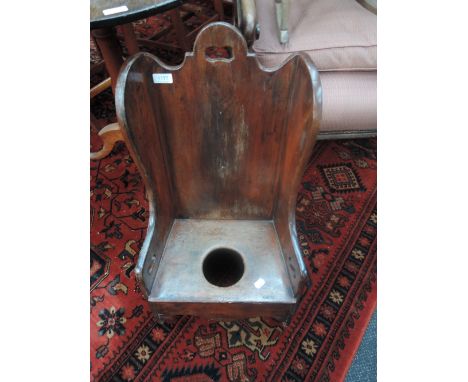 An early 19th century George III mahogany child's commode of 'lambing' style