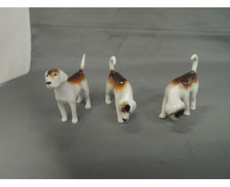 Three Beswick studies, Foxhounds, first version, 942, 943 and 944