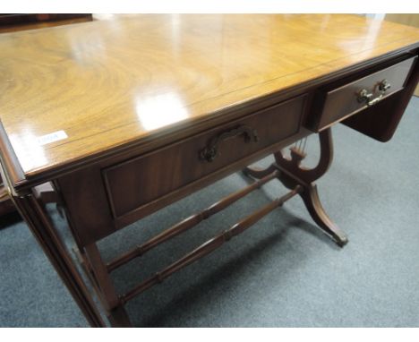 A late 20th century mahogany sofa table of traditional design having frieze drawer and lyre end supports