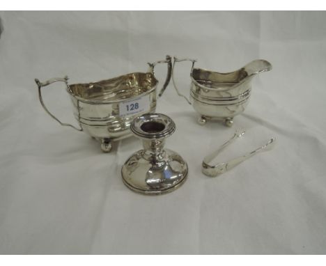 A silver cream jug and sugar bowl having reeded band decoration and bun feet, London 1903, makers marks worn, a pair of HM si