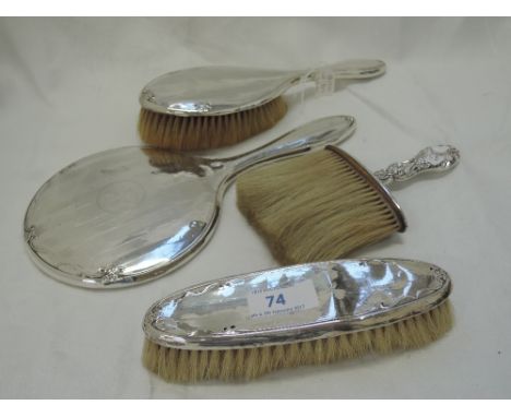 A three piece silver dressing table set having engine turned decoration and initial A to cartouche, Chester 1922, Clark & Sew