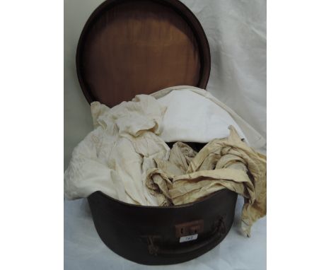 A ladies vintage hatbox containing a selection of linen including child's clothing, pyjama cases, shoe bag, linen bag etc