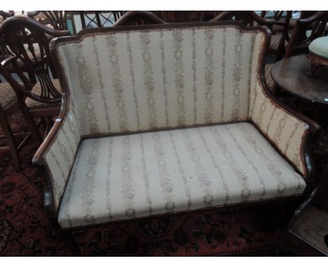 An Edwardian mahogany frame settee having chequer and line inlay decoration with later 20th century tapestry on slender legs