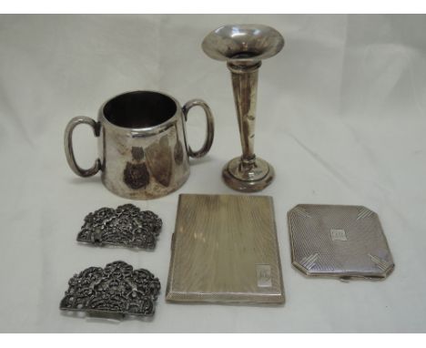 An HM silver powder compact having engine turned decoration, a similar HM silver cigarette case, HM silver bud vase and salt 