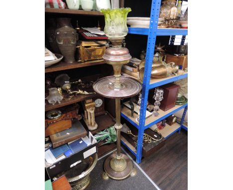 A 19th century brass and copper torchere/oil lamp stand having circular reeded platform column and green etched glass shade