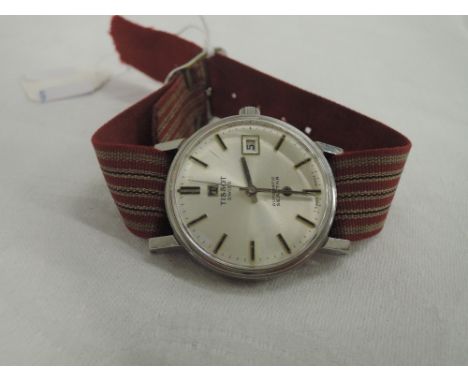 A gents Seastar automatic wrist watch by Tissot having a baton numeral dial with date aperture on a striped canvas strap