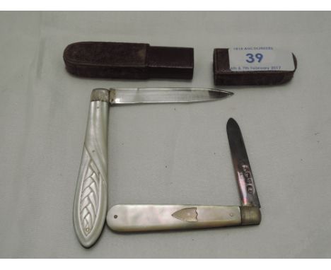 A Victorian cased folding fruit knife having mother of pearl handle with wheat sheaf decoration and silver blade with flower 