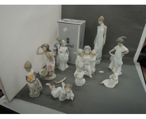 Five Lladro figurines and figure groups including Wedding Bells, boxed and three Nao figurines (some af)