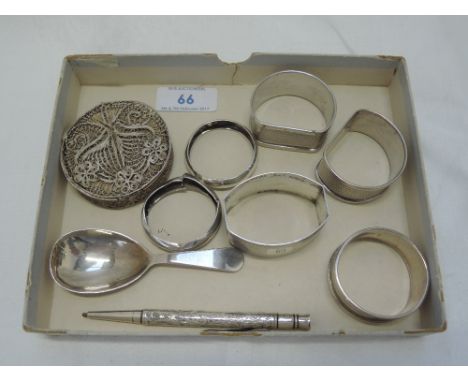 A small selection of HM silver and white metal including six napkin rings, a tea caddy spoon, propelling pencil and filligree