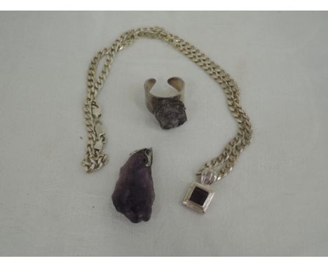 A rough carved amethyst pendant, a square cut amethyst style pendant on white metal curb chain stamped 925 and a 1970's Danis