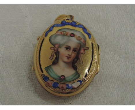 An yellow metal  locket with glass reverse having an enamelled portrait depicting a maiden with ruby and seed pearl decoratio