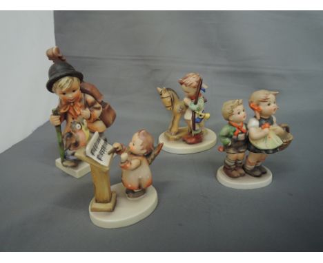 Four Hummel studies, Boy with toy horse, Boy with double bass, Angel with three chicks and Boy and Girl with basket