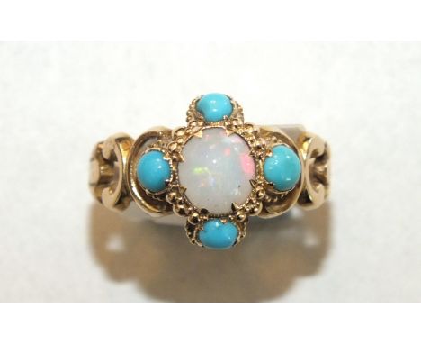 A 19th century ring set opal and turquoise cluster between scrolling shoulders, with engraved shank, unmarked, size K½, 2.7g.