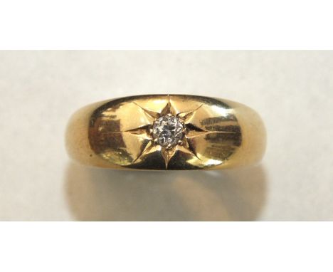 An 18ct gold gipsy ring set single old brilliant-cut diamond, size O½, 4.9g.