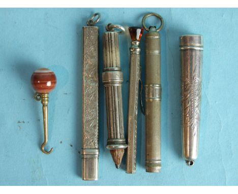 A silver pencil of ribbed form, Birmingham 1896, other pencils, an agate-topped button hook and a silver cheroot case.