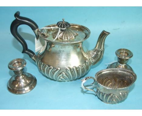 An Edwardian bachelor's half-gadrooned teapot and cream jug, Chester 1903, (inscription removed) and a pair of short loaded t