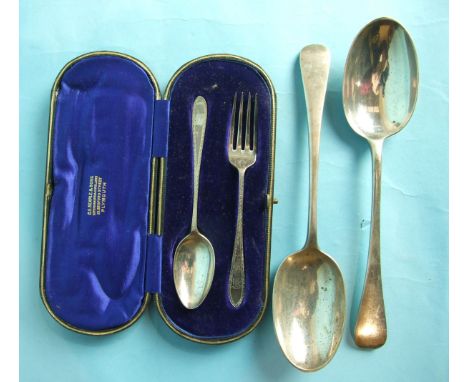 A bright-cut christening spoon and fork in fitted case, Sheffield 1909 and a pair of modern Old English tablespoons.