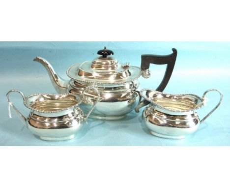 A three-piece plain oblong tea service, London 1934, ___37oz.