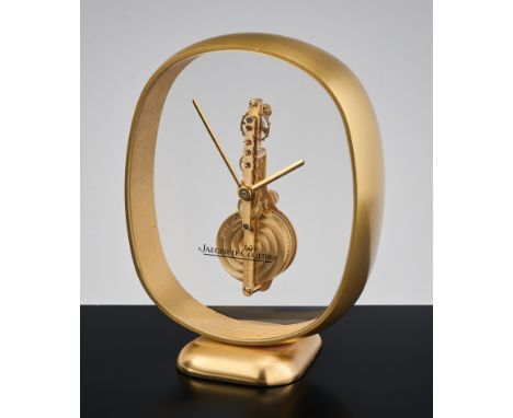 Sehr feine Jaeger-LeCoultre Tischuhr. Elliptisches Messinggehäuse, beidseitig verglast, bzw. iw.o. 16 steiniges Präzisionsank