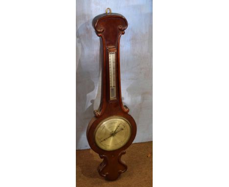 19th century mahogany wheel barometer, scroll pediment over silvered vernier, similar face below (losses), 94cm long  