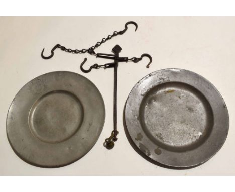 Two pewter plates, stamped to base, together with a chain finger measuring scale, 24cm diam (3)  