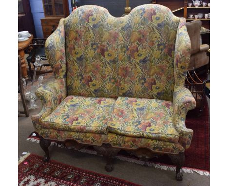 Queen Anne style double hoop backed two-seater wing sofa, mahogany frame with short front supports and claw and ball feet, 13
