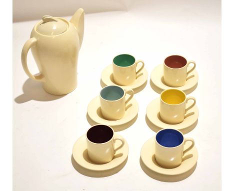 Susie Cooper Art Deco coffee set, comprising coffee pot and six coffee cans and saucers, plain white body to exterior, the co