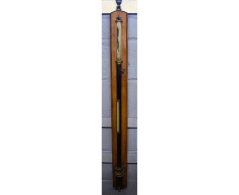 Early 20th century black anodised and brass mounted gimbal barometer mounted on an oak back plate, 105cm long