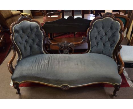 Victorian rosewood double hoop back sofa, splayed back joined in the centre by a scrolled rail with carved foliate detail, se