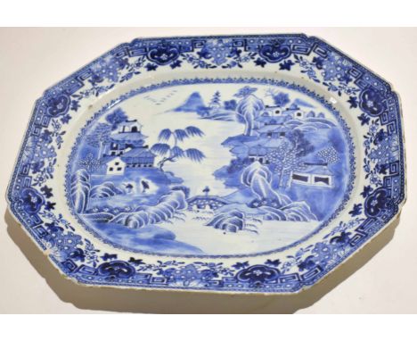 Large 18th century Chinese export blue and white platter decorated in typical fashion with a Chinese islands scene within flo
