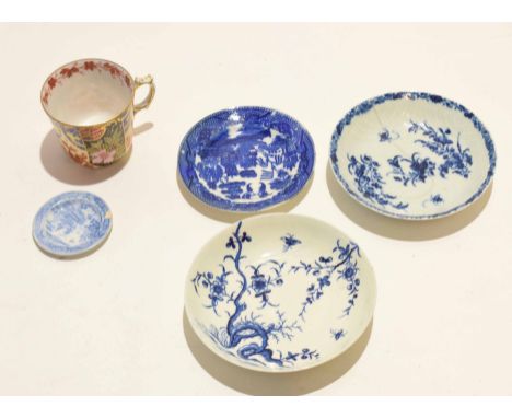 Two 18th century English porcelain saucers with blue and white design, together with smaller saucers and a cup decorated in I