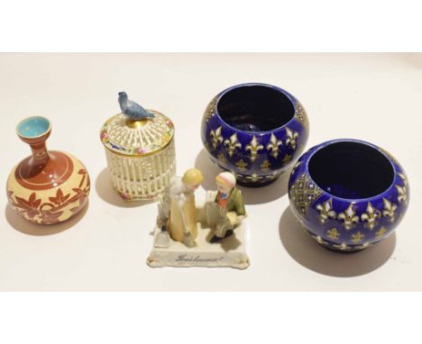 Group of pottery and porcelain items including a Paris porcelain jar and cover with bird finial, a Watcombe vase, two further