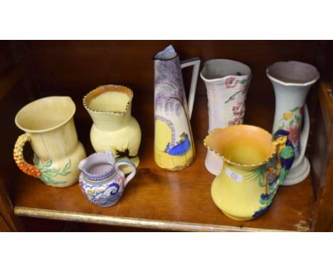 Group of Art Deco pottery including a Poole jug with a geometric design, a Burleigh ware jug with bird handle, a bizarre Clar