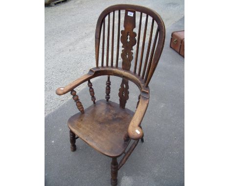 Windsor board arm stick back armchair on turned supports and X shaped under stretcher 