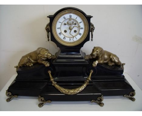 Large and elaborate Victorian black slate break front mantel clock with gilt mounts flanked by a lioness and tiger, with whit