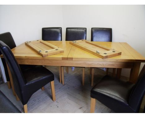 Modern light oak extending dining table and a set of six leather dining chairs (minimum length 204cm, maximum length 270cm) 