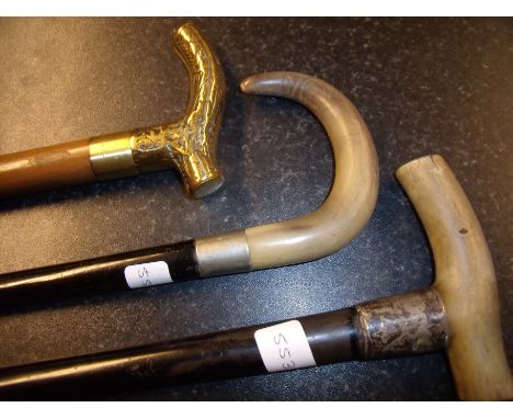 Horn handled and silver hallmarked collared walking stick and two other walking sticks (3) 