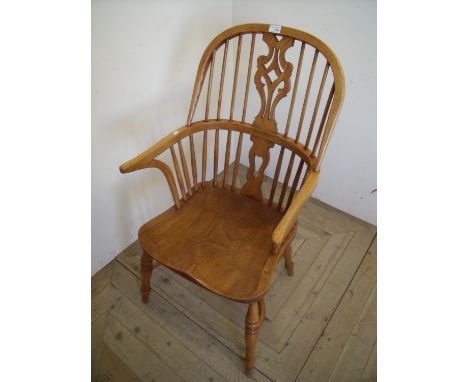 Quality modern light elm Windsor stick back armchair with pierced central splat, crinoline under stretcher and turned support