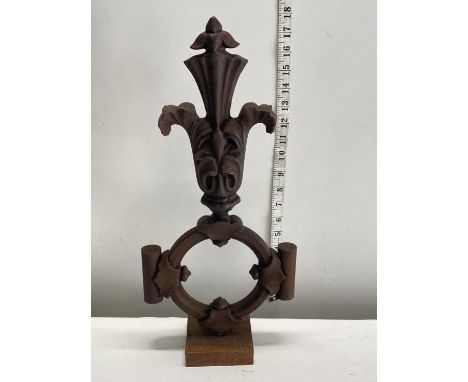 A heavy mid century large wrought iron decorative finial in a stylised Fleur de Lis design, h44cm