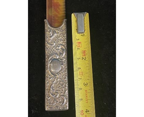 A hallmarked for Birmingham 1906 silver comb holder