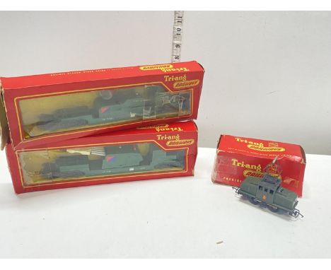 A boxed Tri-ang rocket launcher, a boxed Tri-ang search light with a pentagraph loco