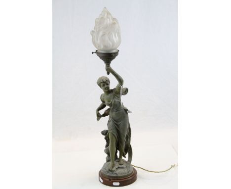 Cast figural table lamp, modelled as a maiden holding a flame, signed to base, height approx.70cm 